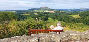 The Eildons, Scottish Borders observed by a man and his dog © David Simpson
