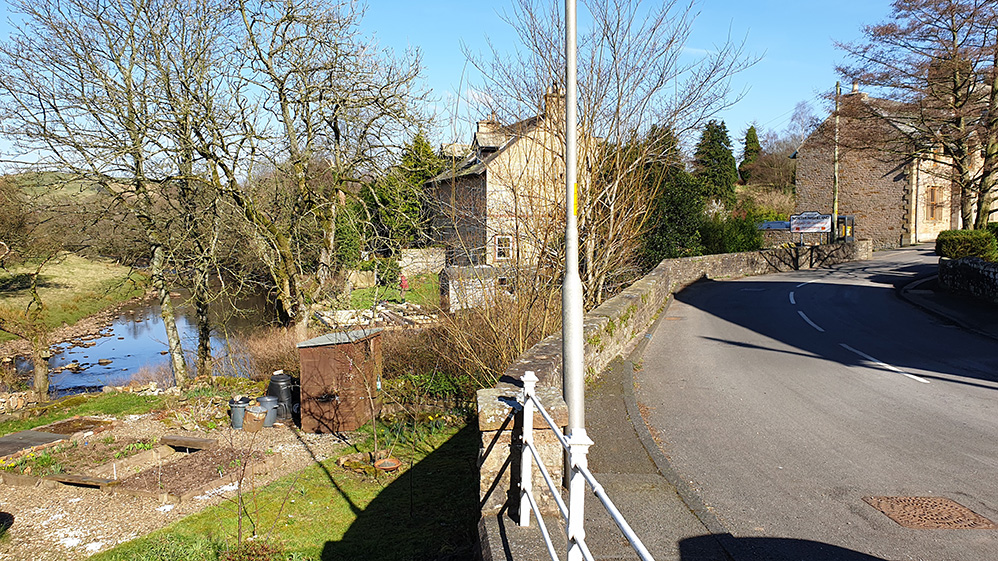 River Irthing (left) at Gilsland with bridge across the Poltross Burn into Northumberland on the right
